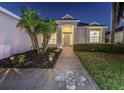 Beautifully landscaped front yard with decorative concrete leading to the home's entrance at 6741 64Th E Ter, Bradenton, FL 34203