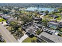 Aerial view of a single-Gathering home showcasing the pool and backyard with mature trees at 4907 21St W Ave, Bradenton, FL 34209