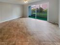 Open living room featuring a tiled floor and a screened in patio at 3425 41St S Ter # 202, St Petersburg, FL 33711