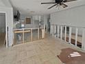 Spacious living room with tile floor, ceiling fan, and window, shown during remodeling stages at 141 81St N Ave, St Petersburg, FL 33702