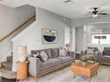 Inviting living room boasts modern decor, neutral tones, and ample seating for relaxation at 8840 Red Beechwood Ct, Riverview, FL 33578