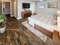 Serene main bedroom with warm floors, natural light and stylish furnishings at 1848 Redcoat Ln, Clearwater, FL 33764