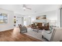 Bright and inviting living room features hardwood floors, modern decor, and ample natural light at 5980 32Nd N Ave, St Petersburg, FL 33710
