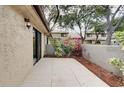 Private patio area featuring nice plants, access via sliding glass door and a cozy outdoor experience at 6262 142Nd N Ave # 1203, Clearwater, FL 33760