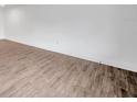Minimalist living space with light wood-style flooring and clean white walls, bathed in natural light at 2353 Shelley St # 8, Clearwater, FL 33765
