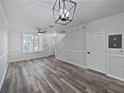 Spacious living room with sleek flooring and natural light. Neutral tones throughout at 6122 Osprey Lake Cir, Riverview, FL 33578