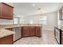 Well-lit kitchen showcasing granite counters, stainless steel appliances, and open layout at 13417 Lake Monroe Pl, Riverview, FL 33579