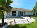 Lovely single-story home boasting beautiful landscaping and a welcoming entrance at 26187 Argentina Dr, Punta Gorda, FL 33983