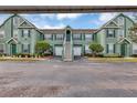 Inviting condominium with pleasing curb appeal, tidy landscaping, and attached garage at 10520 Windsor Lake Ct # 10520, Tampa, FL 33626