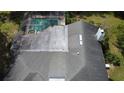 A detailed aerial shot showcases the roof, screened-in pool and backyard of this well-maintained home at 5701 Ainsworth W Ct, Tampa, FL 33647