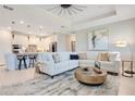 Bright and airy living room with comfortable seating, modern decor, and an open-concept layout at 10735 Spring Tide Way, Parrish, FL 34219