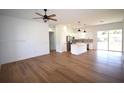 Open-concept living area with kitchen island and stainless steel appliances at 3092 Crowder St, Port Charlotte, FL 33980