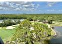 Scenic view of the lush green golf course, showcasing pristine fairways, mature trees, and tranquil water features at 14810 Rue De Bayonne # 7B, Clearwater, FL 33762
