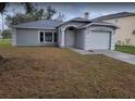 Charming single-story home with a well-maintained lawn and attached garage with an arched entryway at 4601 Copper Ln, Plant City, FL 33566