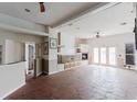 Spacious living room featuring tile flooring, a fireplace, and double doors to the outside at 11120 5Th E St, Treasure Island, FL 33706