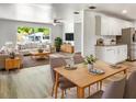 Bright living room and kitchen featuring stylish furniture, appliances, and decor in an open floor plan at 1115 31St W St, Bradenton, FL 34205
