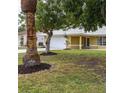 Well-maintained single-Gathering home featuring mature trees and landscaping at 201 Chardin Dr, Nokomis, FL 34275