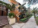 Two-story property featuring lush landscaping, tiled stairs, and a charming entrance at 200 4Th S Ave # 231, St Petersburg, FL 33701