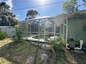 Outdoor swimming pool with screen enclosure at 21285 Peachland Blvd, Port Charlotte, FL 33954