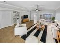 Bright living room featuring stylish furnishings and a ceiling fan at 4914 Trinidad Dr, Land O Lakes, FL 34639