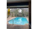 Screened-in pool area with lush landscaping and a relaxing atmosphere at 18660 White Pine Cir, Hudson, FL 34667