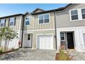 Charming two-story townhome featuring a one-car garage and neutral-toned exterior at 7270 Deer Valley Cir, Tampa, FL 33635