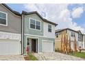 Well-manicured home featuring stylish exteriors, neat landscaping, and paved driveways at 7274 Deer Valley Cir, Tampa, FL 33635