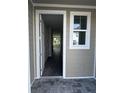 Inviting entryway featuring an open doorway with a view of the home's interior at 7284 Deer Valley Cir, Tampa, FL 33635