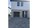 Modern two-story townhome featuring an attached garage and a neatly paved driveway at 7284 Deer Valley Cir, Tampa, FL 33635