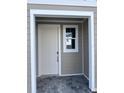 Charming porch featuring a well-lit entryway with a door and window at 7284 Deer Valley Cir, Tampa, FL 33635