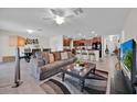 Spacious living room seamlessly connected to an open kitchen, perfect for modern living at 10607 Standing Stone Drive, Wimauma, FL 33598