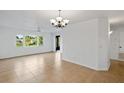 Bright living room featuring tile floors and large windows with natural light at 2486 Caring Way # 17A, Port Charlotte, FL 33952