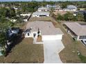 An aerial view of the new home showcasing its spacious lot and multi-car garage at 3105 Lockwood St, Port Charlotte, FL 33952