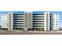 Six-story condo building exterior with unique arch design at 7321 Central Ave # 504, St Petersburg, FL 33710