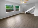 Bright living room with large windows, modern flooring and open floor plan, perfect for relaxation and entertainment at 1857 Clearbrooke Dr, Clearwater, FL 33760