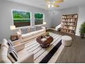 Bright living room with large windows, modern furniture and open floor plan, perfect for relaxation and entertainment at 1857 Clearbrooke Dr, Clearwater, FL 33760
