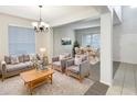 Inviting living room with neutral tones, plush seating, and a dining area filled with natural light, ideal for relaxation at 2007 Rain Dance Pl, Brandon, FL 33510