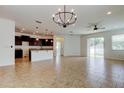 Spacious living room featuring tile floors, lots of natural light and modern ceiling fan at 25242 Carnation Sedge Way, Land O Lakes, FL 34639