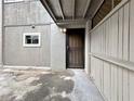 Close-up of the front entry door with a security screen and a small window at 8631 Cattail Dr, Temple Terrace, FL 33637