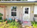 Exterior backyard with a window, door, gardening tools and outdoor decor at 1420 Citrus St, Clearwater, FL 33756