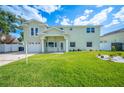 Charming two-story home with a well-manicured lawn and inviting front entrance at 8704 Bay Crest Ln, Tampa, FL 33615