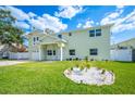Charming two-story home with a well-manicured lawn and inviting front entrance at 8704 Bay Crest Ln, Tampa, FL 33615