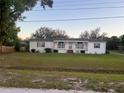 Spacious single-story residence with a lush front yard and a charming covered entryway at 4435 Tevalo Dr, Valrico, FL 33596