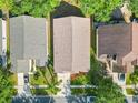 Aerial view of a home showing the roof, landscaping, driveway, and surrounding neighborhood at 12511 Lake Vista Dr, Gibsonton, FL 33534