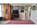 Inviting entryway featuring a decorative wooden door and neutral-toned flooring at 6639 Renaldo S Way, St Petersburg, FL 33707