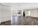 Spacious living room next to the kitchen, featuring hardwood floors at 8857 Highpoint Blvd, Brooksville, FL 34613