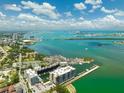 Aerial view of condos with waterfront views of boats, waterways, and the city at 920 N Osceola Ave # 803, Clearwater, FL 33755