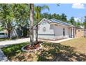 Charming home with a manicured lawn, decorative front, and a well-lit exterior, perfect for evening enjoyment at 754 Cape Cod Cir, Valrico, FL 33594