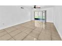 Bright living room with tile flooring and sliding glass doors leading to outdoor space at 8608 Huron Ct # 57, Tampa, FL 33614