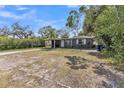 Cozy single-story home with a tidy front lawn and mature trees at 3424 19Th N St, St Petersburg, FL 33713